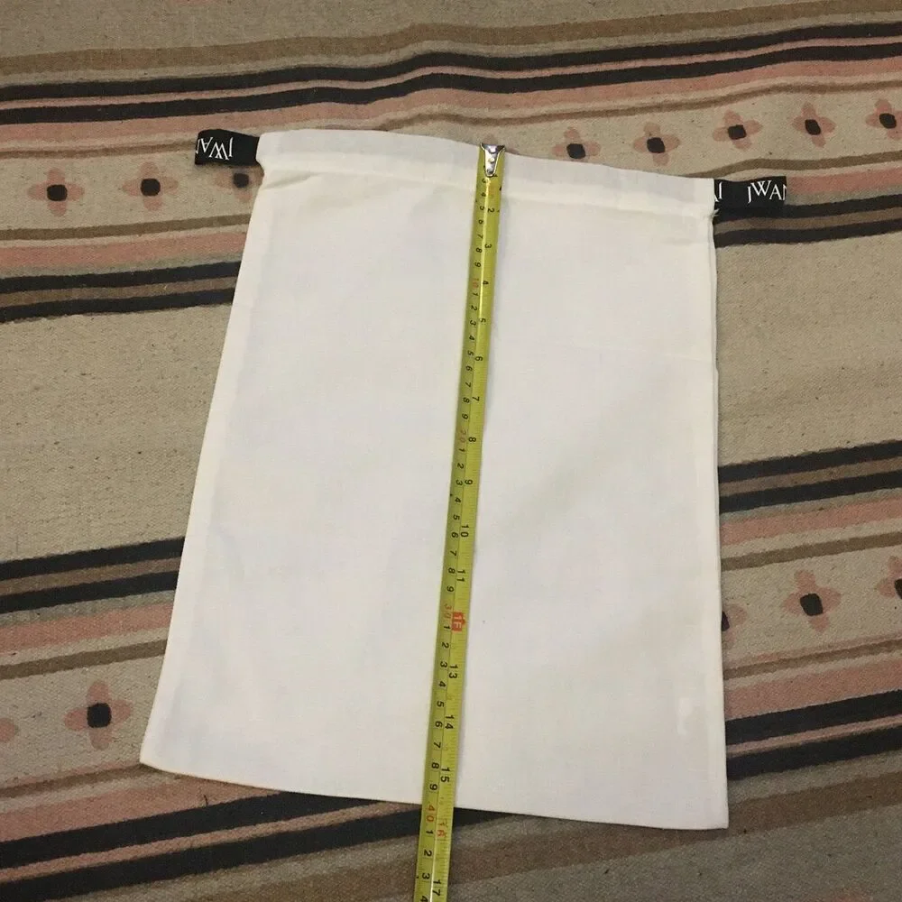 J.W. Anderson White w/ Black drawstring ribbon & logo in white 11” x 15”